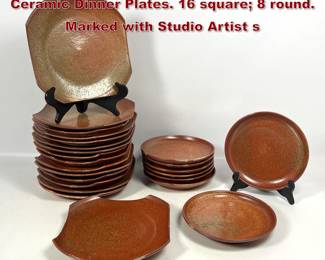 Lot 659 Collection of 24 Rust Glazed Ceramic Dinner Plates. 16 square 8 round. Marked with Studio Artist s 
