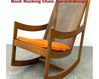 Lot 1132 Mid Century Modern Walnut Cane Back Rocking Chair. Curved design. 
