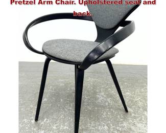 Lot 1043 NORMAN CHERNER Ebonized Wood Pretzel Arm Chair. Upholstered seat and back.