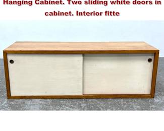 Lot 867 Paul McCobb American Modern Wall Hanging Cabinet. Two sliding white doors in cabinet. Interior fitte