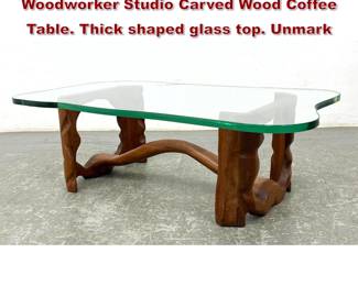 Lot 608 Phil Powell Style Artisan Woodworker Studio Carved Wood Coffee Table. Thick shaped glass top. Unmark