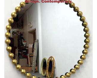 Lot 1173 Brass tone Round Mirror with Ball design. Contemporary.