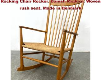 Lot 1148 Hans Wegner Tall Spindle Back Rocking Chair Rocker. Danish Modern. Woven rush seat. Made in Denmark 