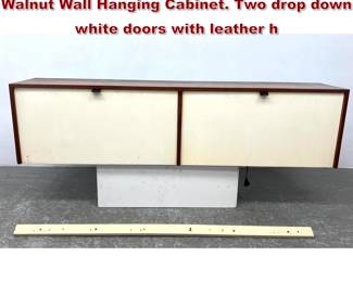 Lot 742 Florence KNOLL American Modern Walnut Wall Hanging Cabinet. Two drop down white doors with leather h