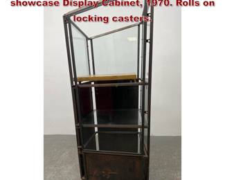 Lot 809 Custom made asymmetric Iron showcase Display Cabinet, 1970. Rolls on locking casters. 