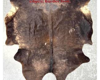 Lot 821 Natural Hide Fur Rug. Dark. Finished edges border trim. 