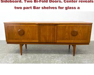 Lot 1065 BEAUTILITY Bar Cabinet Sideboard. Two BiFold Doors. Center reveals two part Bar shelves for glass a