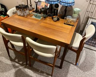 Ansager Mobler Danish Mid-Century Modern extending dining table; eight MCM Benny Lind chairs (four shown here, and four shown in the following photo).