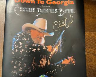 Signed Charlie Daniels Fiddle with AOC as well as picture and song sheet from The Devil Went Down to Georgia.