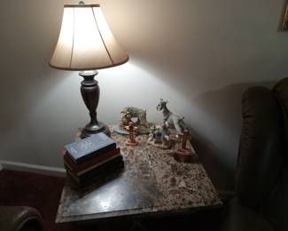 Lamp, marble top table, books