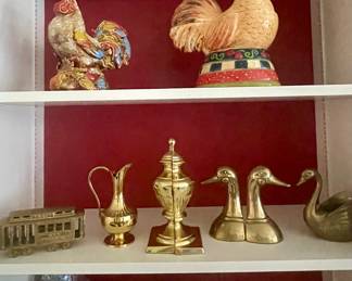 Roosters, Brass bookends, brass trolley car, brass vase, brass swan, brass duck bookends, various ceramic, porcelain and brass pieces.