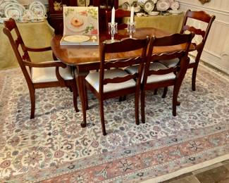 Dining room table with six chairs and two leafs.         Wool rug 9’ x 11 1/2