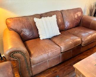 Brown leather couch with nailhead trim 