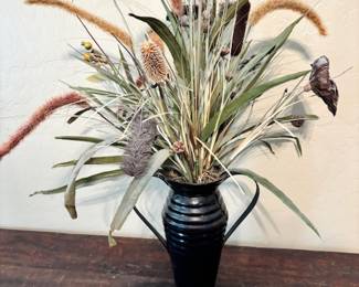 Faux floral arrangement in black metal vase 
