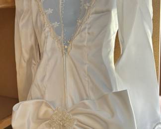 Wedding dress with sheer back, bow and pearls 