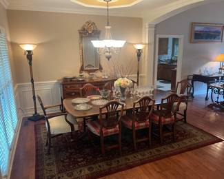 Beautiful Herendon dining table with 8 chairs. 6 more chairs available. Table with 3 leaves will seat 14