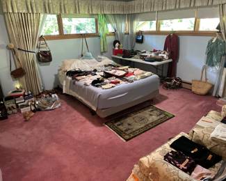 There are a 2 pairs of Men’s Allen Edmund’s shoes, 1 pair is shark skin. There is also a kangaroo leather purse.