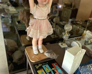 Vintage Barbies, lots of beautiful Barbie clothes that was very well kept. Also, the big doll is 1960 Merican Doll