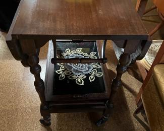 Vintage drop leaf tea cart on wheels. Comes with a serving tray