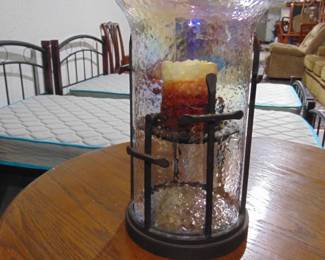 Glass candle holder  sold with candle that runs on batteries