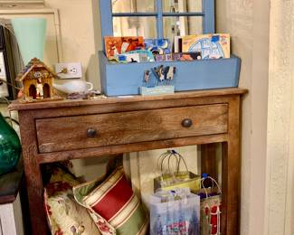 Vintage wood sofa table. Window sill with mirror