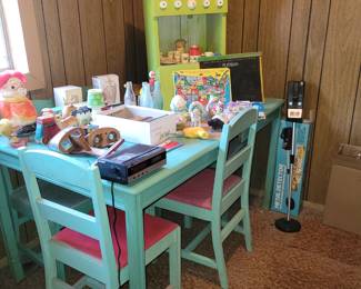 Dining table and chairs with some toys