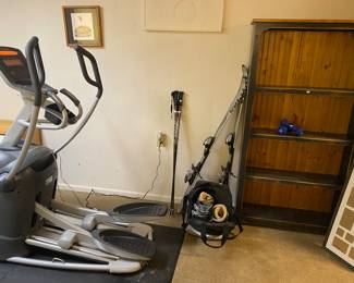 skis, boots and poles, beautiful bookcase, Elliptical