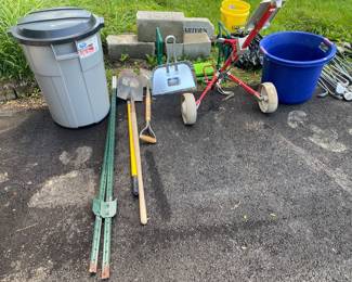 yard tools, T posts, gold bag carts (2), rubber made trash cans with lids, gold clubs, tote