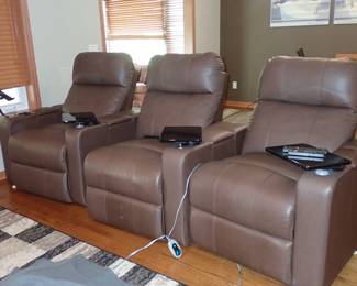 Theatre seating with electric reclining, cup holder & tray. 