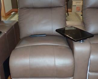 Theatre seating with electric reclining, cup holder & tray. 