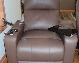 Theatre seating with electric reclining, cup holder & tray. 