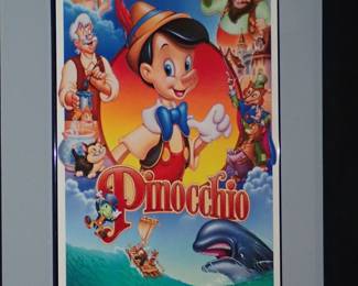 Large movie posters framed Pinocchio.