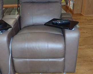 Theatre seating with electric reclining, cup holder & tray. 