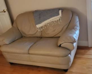 Cream color leather loveseat 