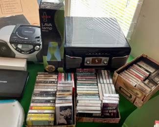 Stereo. Boombox. Lava lamp. DVD player. Cassette tapes.