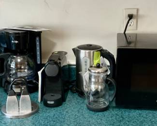 Kitchen items - microwave, Mr Coffee coffee pot x 2, Nespresso coffee/espresso maker, West Bend fondue pot, wine rack, chopper, salt & pepper/napkin set.