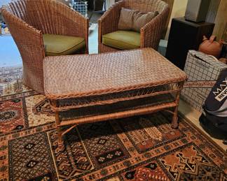 Nice area rug, pair of wicker chairs, wicker coffee table and other items (items sold separately).