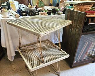 Pair of outdoor metal tables, vinyl albums and kitchen items (items sold separately).