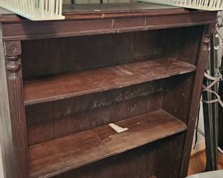 3 shelf mahogany bookcase and wicker bed tray (items sold separately).