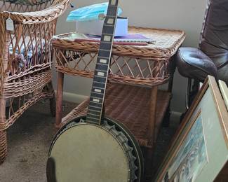 Banjo, framed art, wicker side table (items sold separately).