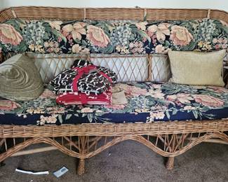 Wicker sofa and cushions.