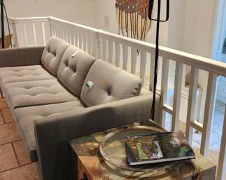Andy Sofa by Ligne Roset, Wrought Iron Floor Lamp,	Fabric Wrapped and Painted Storage Cube, Abstract Mixed Media Wall Sculpture