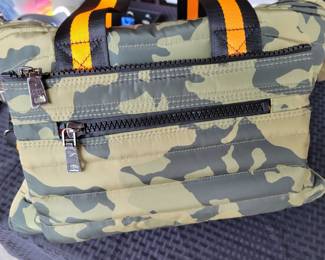 Woman's Handbags THINK ROYLN - The Highlander Duffel Bag w/ Trolly Sleeve- this bag is loaded with pockets and plenty of storage done in camo military green and bright orange/black accents. Description
Travel plans? If not, you'll definitely want to make them once you get your hands on this fab bag. With a convenient trolley sleeve and plenty of exterior pockets (and interior space!) this duffel bag keeps you organized (and looking so cute paired with your airport athleisure 'fit!). From Think Royln.
Style: The Highlander
Reversible strap, trolley sleeve, top zip entry, four zip pockets
Lined interior, zip pocket
Measures approximately 16" x 12.75" with a 52" strap; weighs 2.17 lbs
Shell 100% nylon; lining 100% polyesterOUR PRICE $40.00(list $99-$258 on ebay)