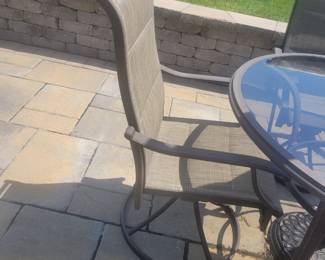 QUALITY GREAT CONDITION HAMPTON BAY ROUND GLASS TOP PATIO TABLE WITH FOUR ARMMED SWIVEL CHAIRS $150......UMBRELLA AND BASE PRICED SEPARATELY @$50- TOTAL $200 FOR PATIO SET WITH UMBRELLA AND BASE