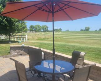 QUALITY GREAT CONDITION HAMPTON BAY ROUND GLASS TOP PATIO TABLE WITH FOUR ARMMED SWIVEL CHAIRS $150......UMBRELLA AND BASE PRICED SEPARATELY @$50- TOTAL $200 FOR PATIO SET WITH UMBRELLA AND BASE