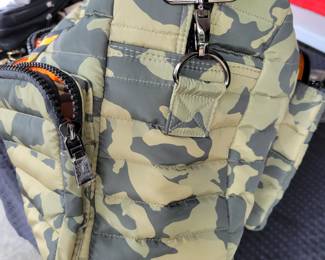 Woman's Handbags THINK ROYLN - The Highlander Duffel Bag w/ Trolly Sleeve- this bag is loaded with pockets and plenty of storage done in camo military green and bright orange/black accents. Description
Travel plans? If not, you'll definitely want to make them once you get your hands on this fab bag. With a convenient trolley sleeve and plenty of exterior pockets (and interior space!) this duffel bag keeps you organized (and looking so cute paired with your airport athleisure 'fit!). From Think Royln.
Style: The Highlander
Reversible strap, trolley sleeve, top zip entry, four zip pockets
Lined interior, zip pocket
Measures approximately 16" x 12.75" with a 52" strap; weighs 2.17 lbs
Shell 100% nylon; lining 100% polyesterOUR PRICE $40.00(list $99-$258 on ebay)