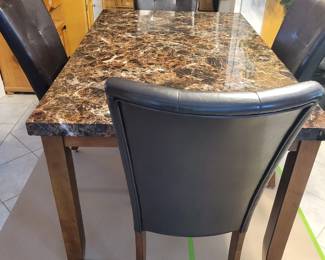 DINING TABLE AND FOUR CHAIRS $100