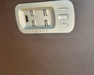 STATE OF THE ART -- TWO LA-Z-BOY ROCKING POWER LEATHER RECLINERS WITH POWER HEADREST AND BACK INFLATING SUPPORT AND ELECTRONIC CHARGING FOR YOUR PHONE/TABLET - $250 EACH