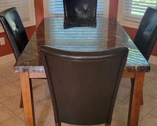 DINING TABLE AND FOUR CHAIRS $100