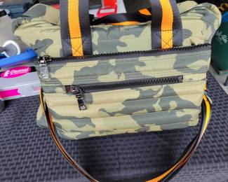 Woman's Handbags THINK ROYLN - The Highlander Duffel Bag w/ Trolly Sleeve- this bag is loaded with pockets and plenty of storage done in camo military green and bright orange/black accents. Description
Travel plans? If not, you'll definitely want to make them once you get your hands on this fab bag. With a convenient trolley sleeve and plenty of exterior pockets (and interior space!) this duffel bag keeps you organized (and looking so cute paired with your airport athleisure 'fit!). From Think Royln.
Style: The Highlander
Reversible strap, trolley sleeve, top zip entry, four zip pockets
Lined interior, zip pocket
Measures approximately 16" x 12.75" with a 52" strap; weighs 2.17 lbs
Shell 100% nylon; lining 100% polyesterOUR PRICE $40.00(list $99-$258 on ebay)